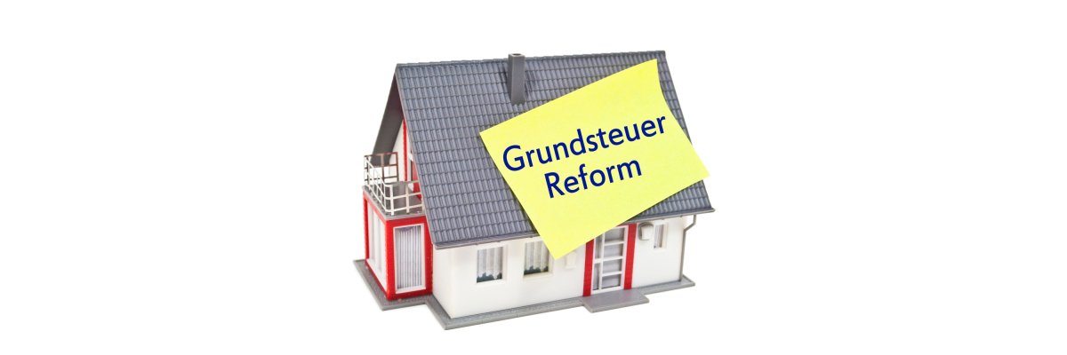 The graphic shows a house with a Post-It with the words Property Tax Reform stuck to it.