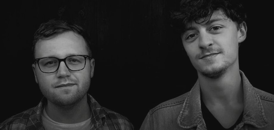 The photo shows the two musicians with the lettering Cat called Molly.
