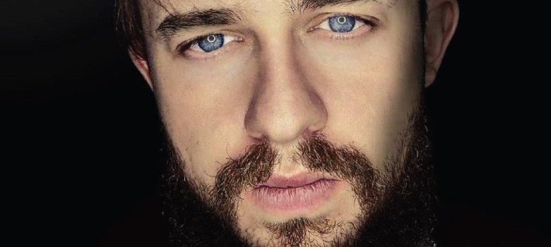 The photo shows a close-up of Kevin Q's face.