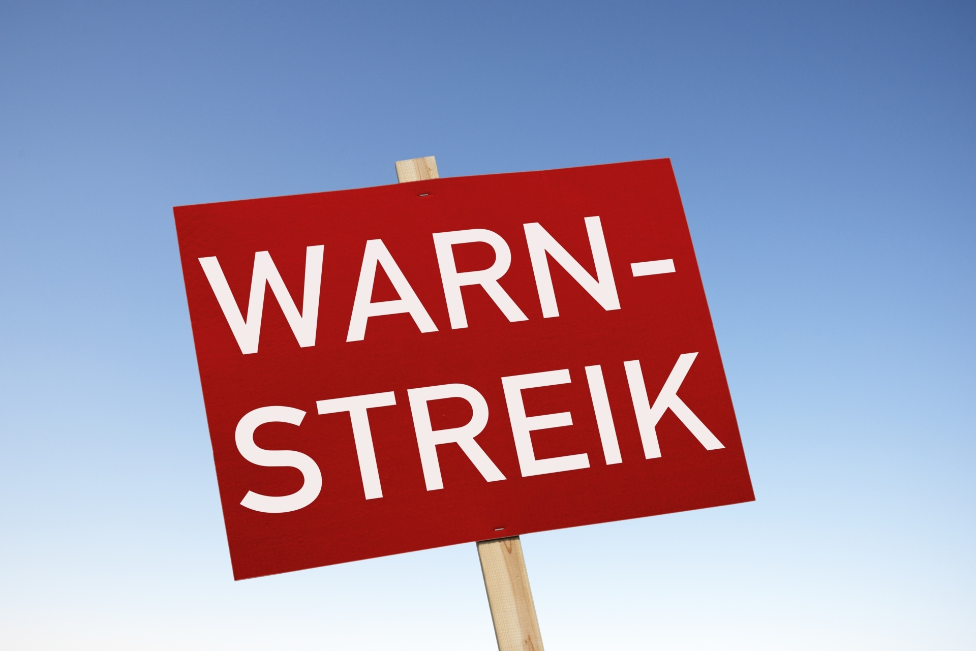 The photo shows a sign with the inscription "Warning strike".