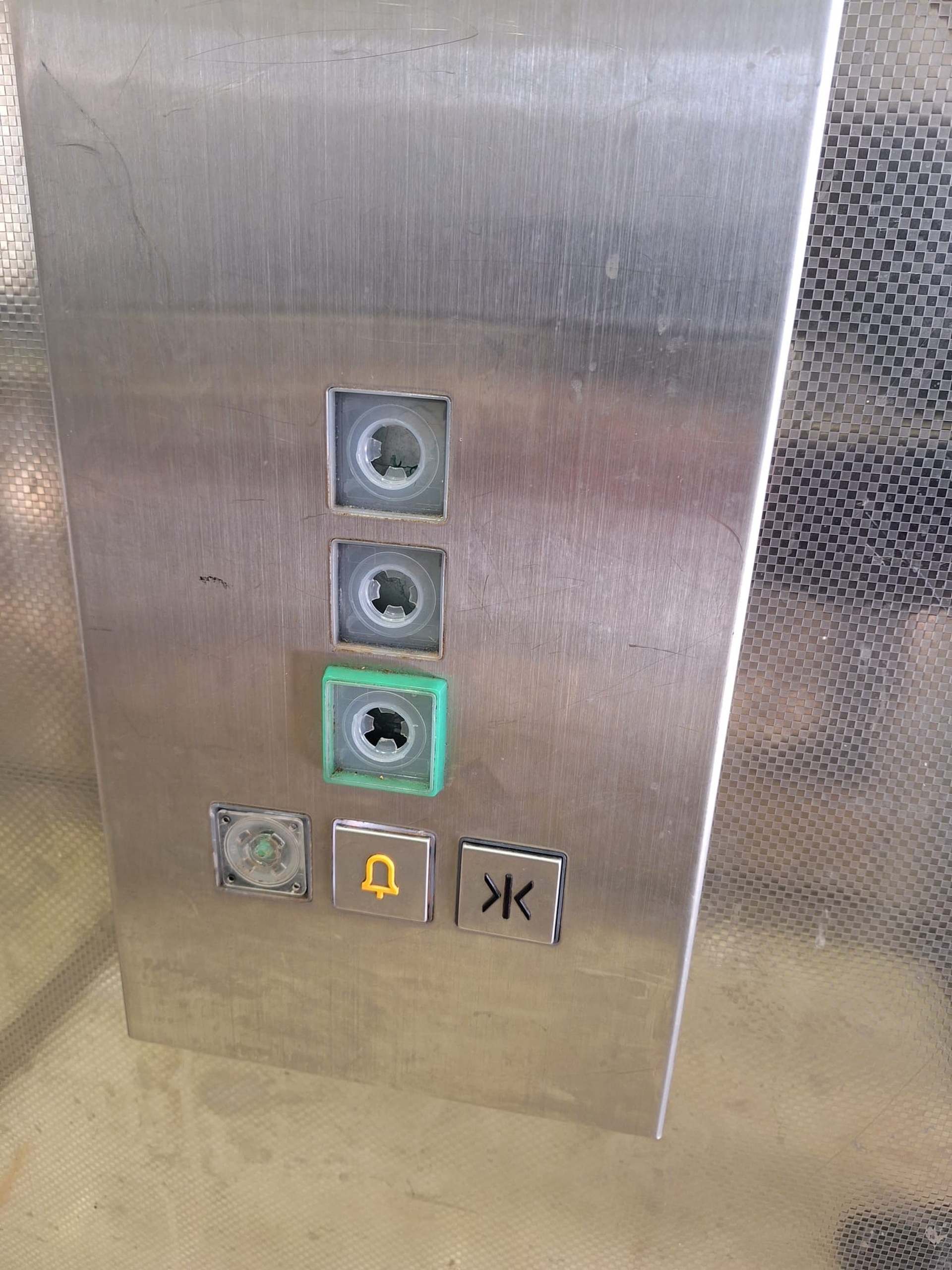 The photo shows the elevator control panel that was damaged.