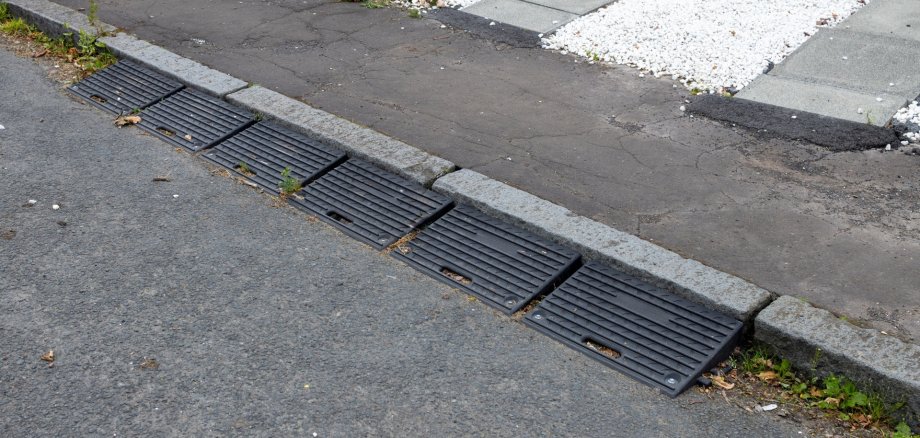 The photo shows a kerb ramp.