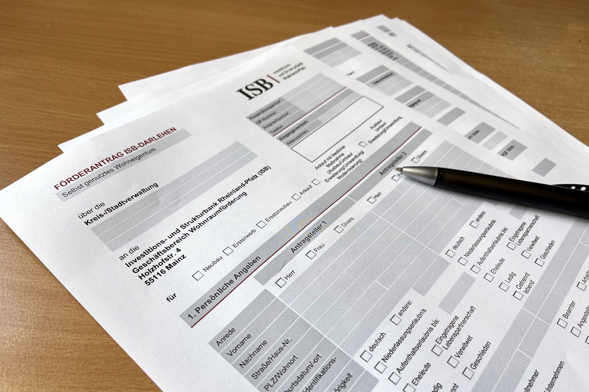 The photo shows the form for an ISB funding application.