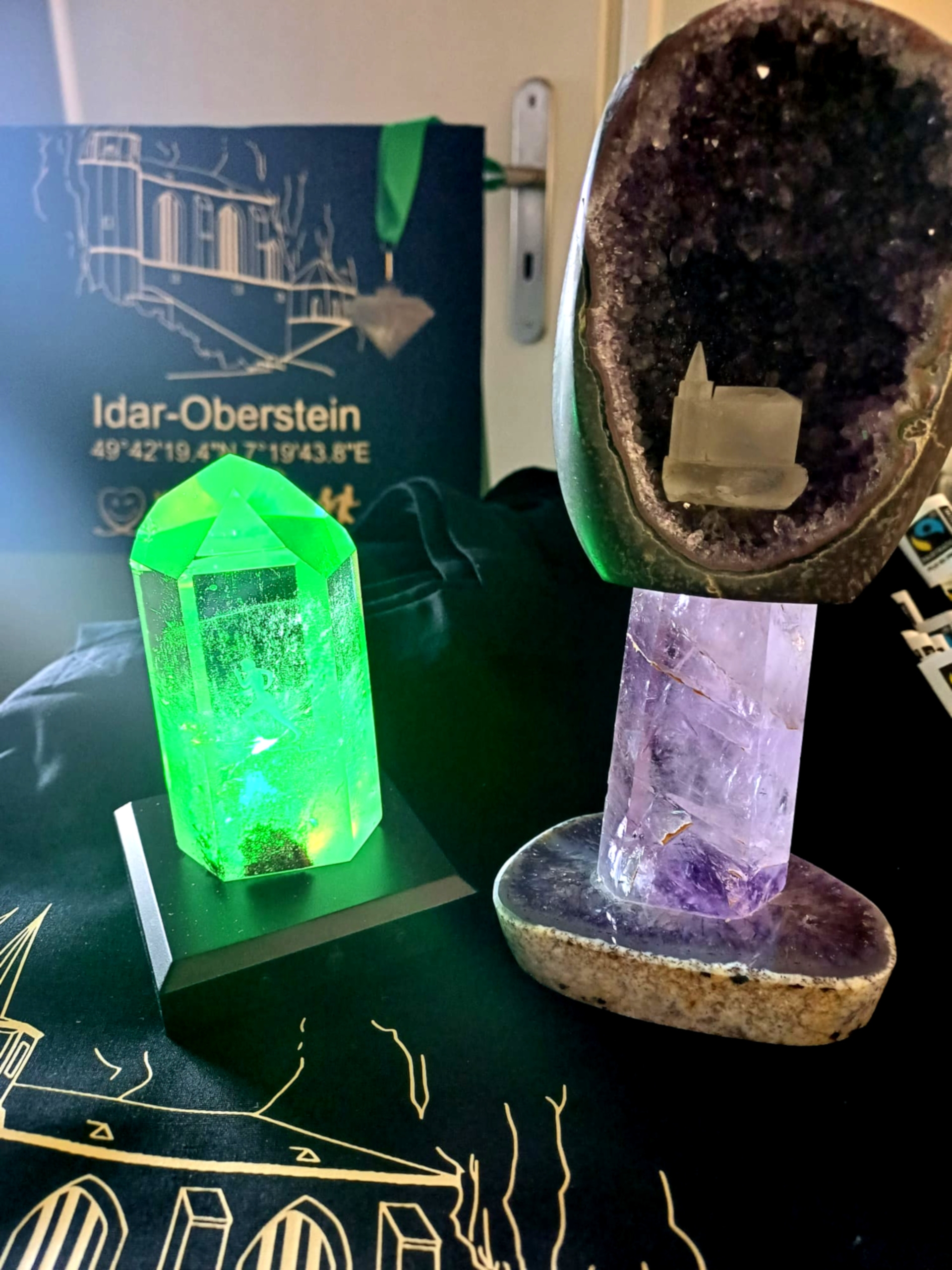 The photo shows the two challenge trophies. These are precious stone objects.