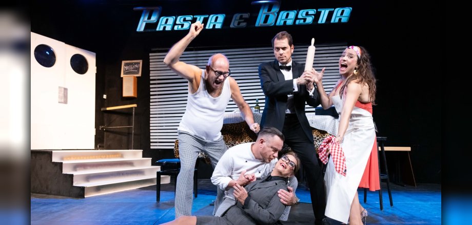 The photo shows a scene from the play.