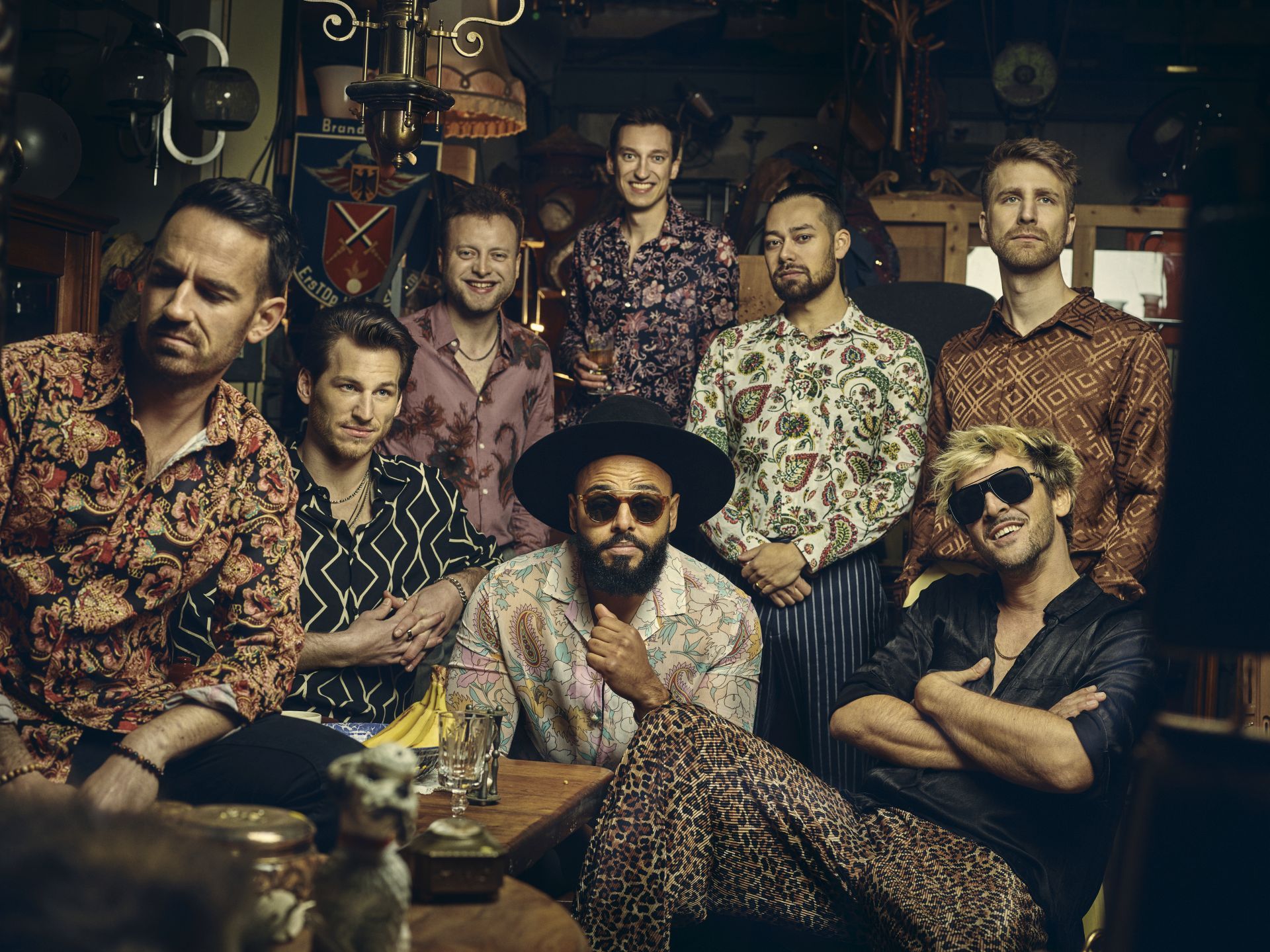 The photo shows the eight band members.