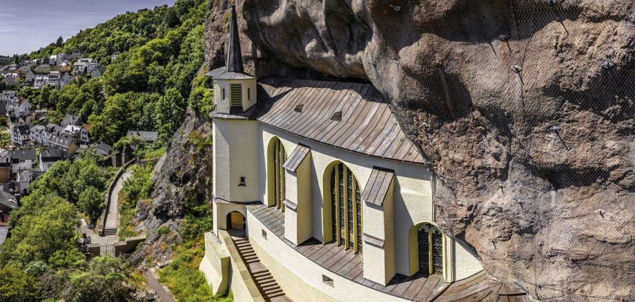 The photo shows a drone shot of the rock church.