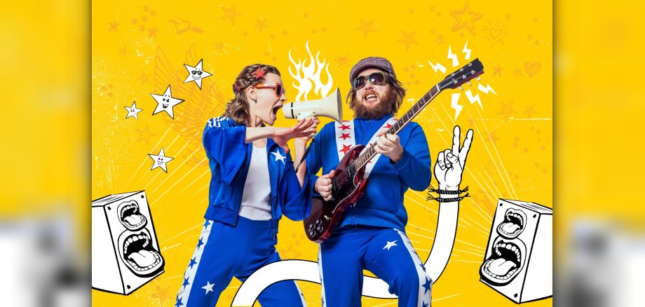 Pia and Nino are really letting loose. The photo shows a promotional image featuring the two band members against a yellow background.