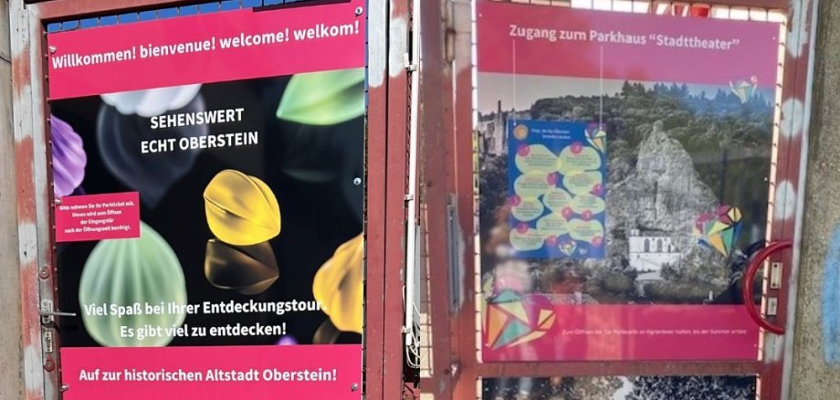 Das Foto zeigt zwei Türen, die am Parkhaus Stadttheater, die mit Motiven der Altstadt und Darstellungen von Edelsteinen neu gestaltet wurden und jetzt ansehnlicher sind. 